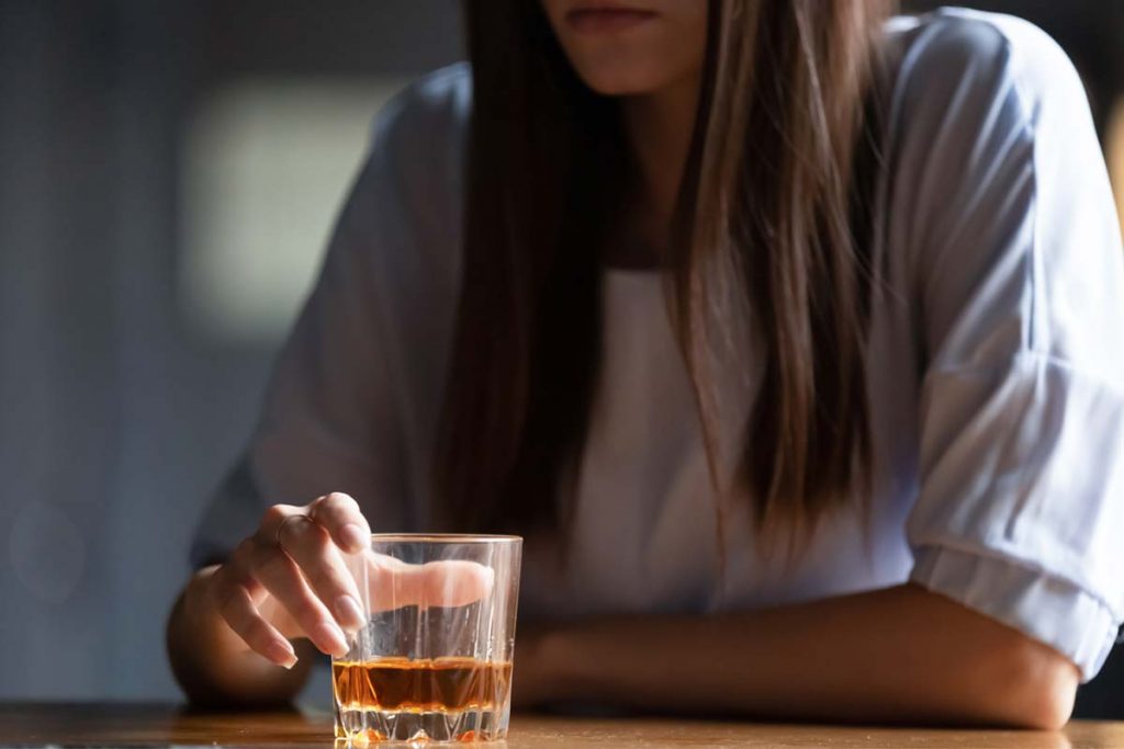 woman drinking wondering is alcohol a depressant