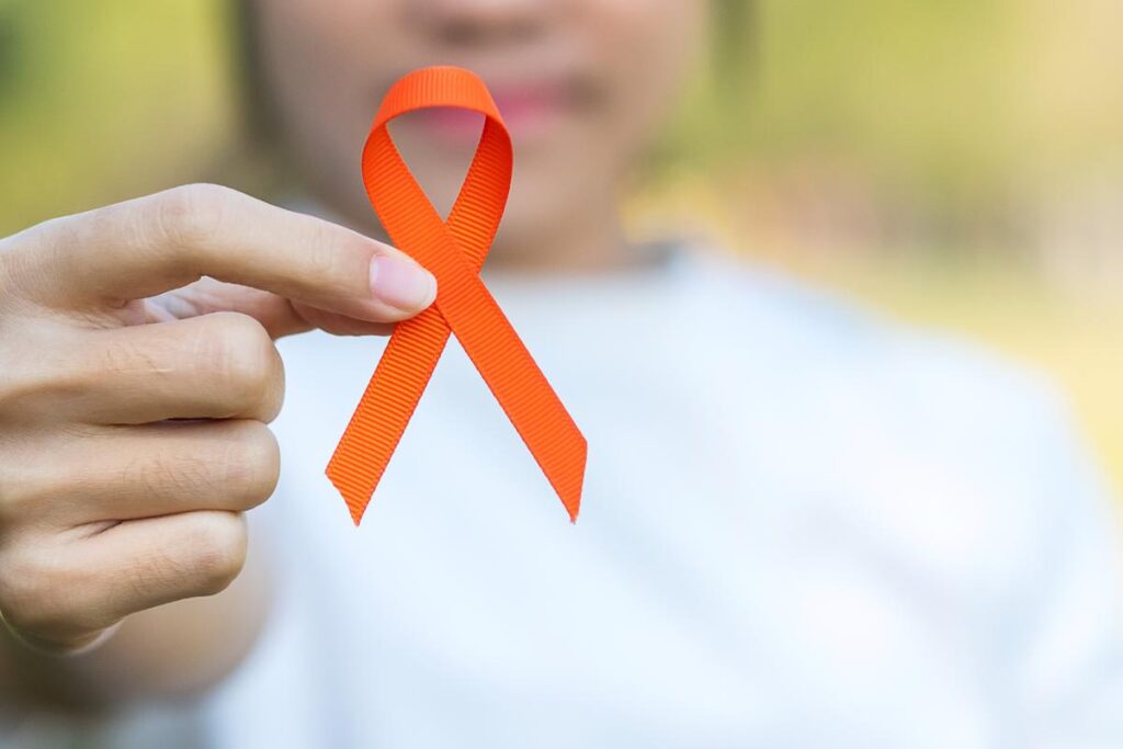 orange ribbon representing Self Harm Awareness Month